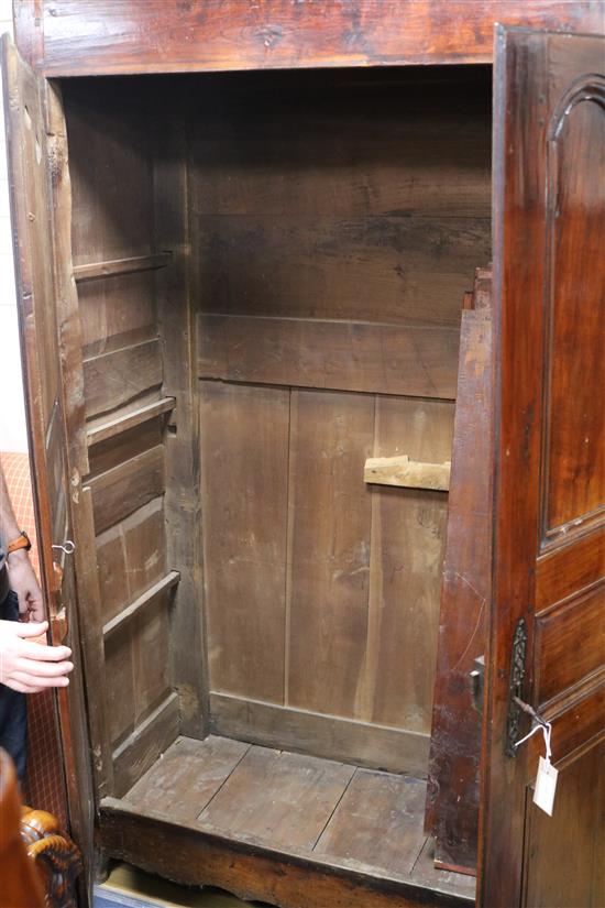 An 18th century French fruitwood armoire W.150cm